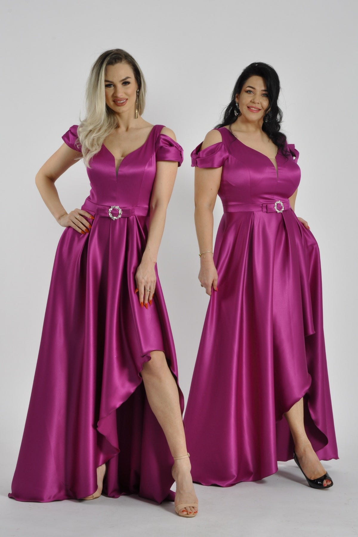 Abito fucsia svasato in taffetà, più corto davanti e lungo dietro, da Moda-Mania, vista frontale con dettagli eleganti.