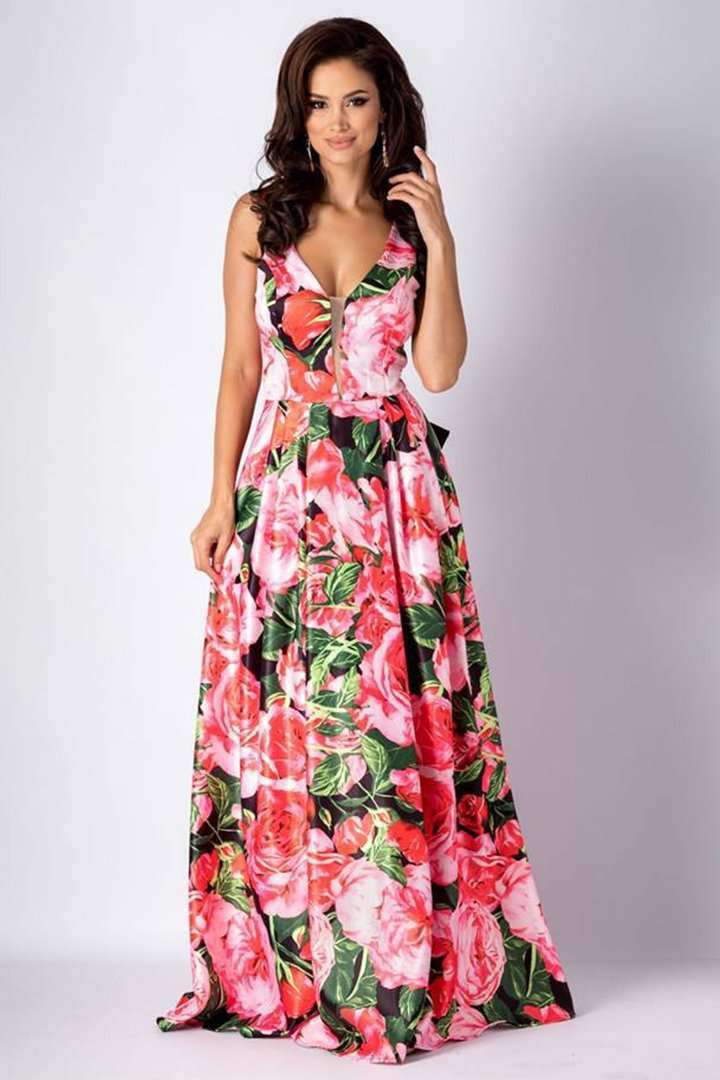 Abito lungo svasato Artista con fantasia floreale rosa e nera, fiocco nero decorativo e schiena scoperta.