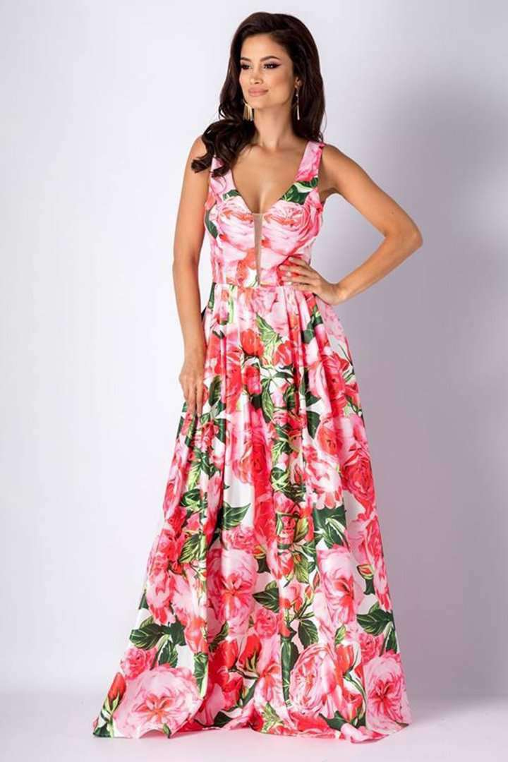 Abito lungo svasato Artista con fantasia floreale rosa e verde, fiocco verde smeraldo e schiena scoperta, dettaglio elegante.