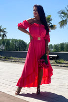 Abito estivo corto e lungo fucsia Moda-Mania, con scollo a barchetta, maniche rimovibili e cintura, vista frontale.