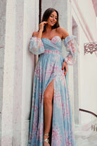 Abito lungo rosa con fantasia floreale in georgette, scollo a cuore e maniche lunghe rimovibili, firmato Moda-Mania.