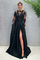 Abito lungo nero Moda-Mania, svasato con corpetto a manica lunga in tulle floreale 3D e gonna in taffetà.