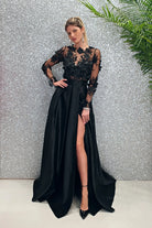 Abito lungo svasato nero Moda-Mania con corpetto in tulle floreale 3D e gonna in taffetà, maniche lunghe e stile elegante.