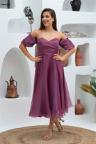 Abito lungo magenta svasato in organza con scollo a cuore e maniche cadenti, firmato Moda-Mania.