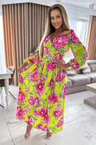 Abito lungo svasato giallo con stampa floreale, spacco e cintura elasticizzata, Moda-Mania, abiti lunghi femminili.