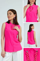 Camicia fucsia senza maniche di Moda-Mania con catenella nera rimovibile, dettaglio elegante e accessoriato.