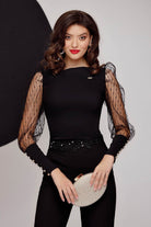 Camicia nera elegante Fofy con maniche a sbuffo in tulle e polsini alti, stile sofisticato e dettagli raffinati.