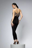 Canotta leopardata Moda-Mania in tessuto satinato con spalline in strass, stile trendy e glamour.