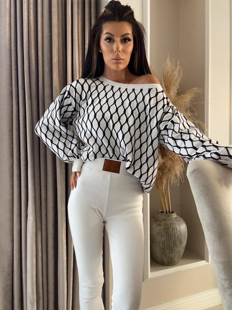 Maglione oversize a stampa geometrica bicolore bianco nero con collo e polsini a coste