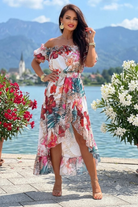 Abito estivo bianco Moda-Mania, corto davanti e lungo dietro con stampa floreale e leopardata, scollo a fascia e cintura.