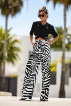 Pantaloni lunghi a palazzo fantasia zebrata con tasche laterali e vita medio alta