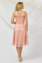 Abito corto svasato rosa pesca in tulle con micro pois e fodera in raso con coppe a cuore, marca Pretty Girl.