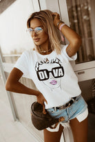 T-shirt bianco in cotone Moda Mania con stampa donna occhiali e scritta Diva, maniche corte con risvolto.