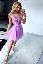 Abito corto svasato princess rosa di Moda Mania con corpetto in perline e gonna in tulle glitterato, stile elegante e femminile.