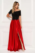 Abito lungo Artista con corpino nero e gonna svasata rossa ricamata in vita, elegante vestito da sera femminile.