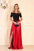 Abito lungo Artista con corpino nero e gonna svasata rossa ricamata in vita, elegante e femminile, dettaglio di moda e stile.