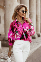 Camicia fucsia a fantasia floreale Moda-Mania con bottoni, tessuto leggero e dettagli decorativi, maniche lunghe e colletto classico