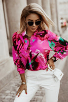 Camicia fucsia a fantasia floreale Moda-Mania con bottoni, maniche lunghe e dettaglio in tessuto leggero.