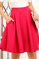 Gonna a ruota tre quarti svasata fucsia corallo Fofy con tasche laterali, vita alta e stile femminile.