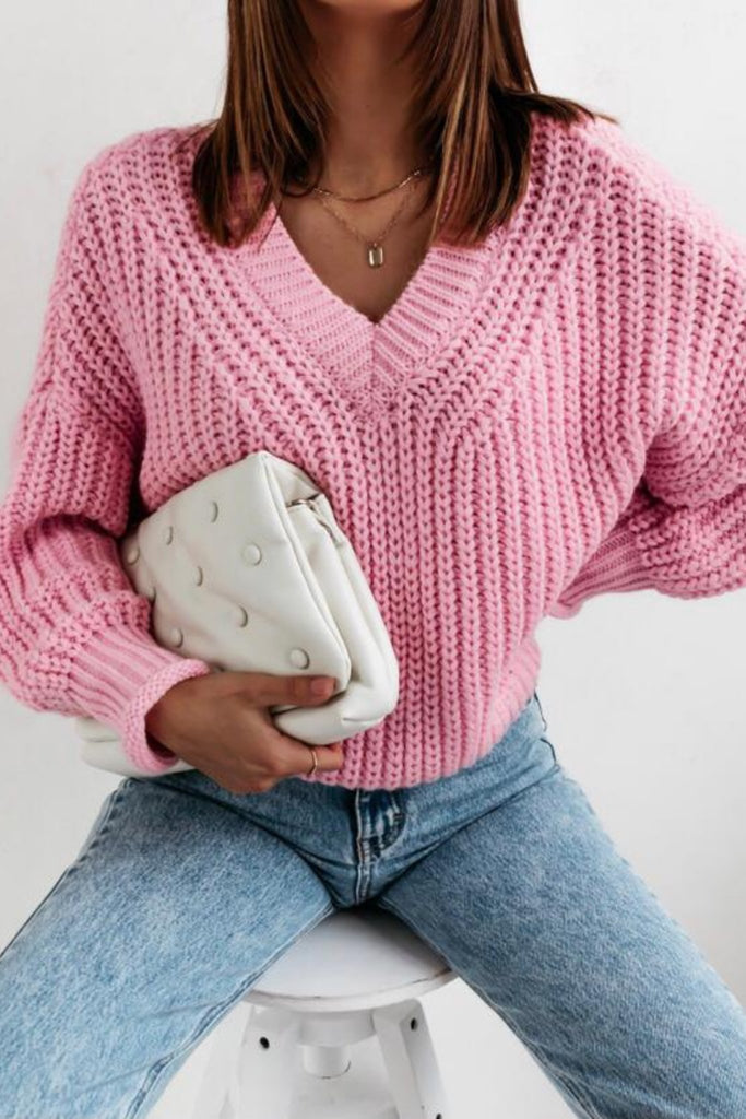 Maglione rosa oversize con taglio ampio e scollo a V