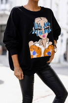Maglia felpa oversize nera in cotone Moda-Mania con stampa ragazza e polsini elasticizzati, morbida e comoda.