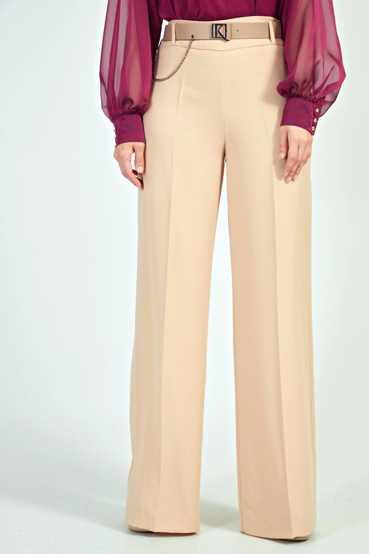 Pantaloni beige panna a gamba larga Moda-Mania con cintura e finte tasche, stile elegante e casual.